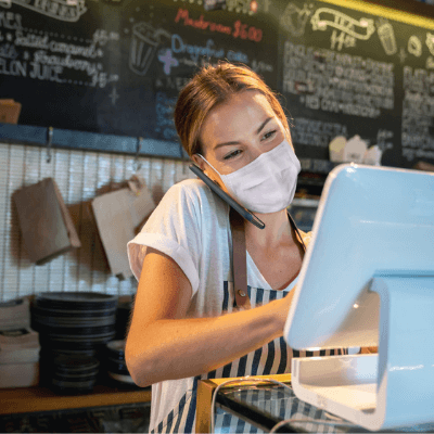 Supporting your workforce - cafe worker wearing a face mask following COVID-19 regulations